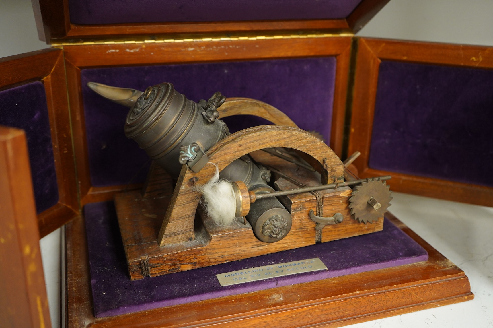A teak cased presentation model of a bombarda mortar cannon in an oak frame, presented to Admiral Sir Michael Pollock from the Chief of Staff of the Italian Navy, with applied plaque to the lid engraved; ‘To Admiral Sir